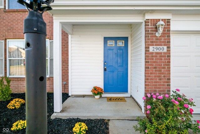 property entrance featuring a garage