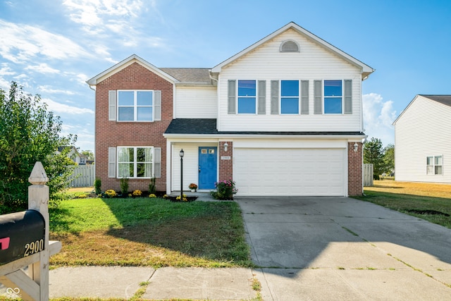 view of front of property with a garage and a front lawn