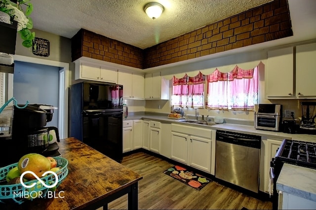 kitchen featuring hardwood / wood-style flooring, white cabinetry, dishwasher, and black refrigerator