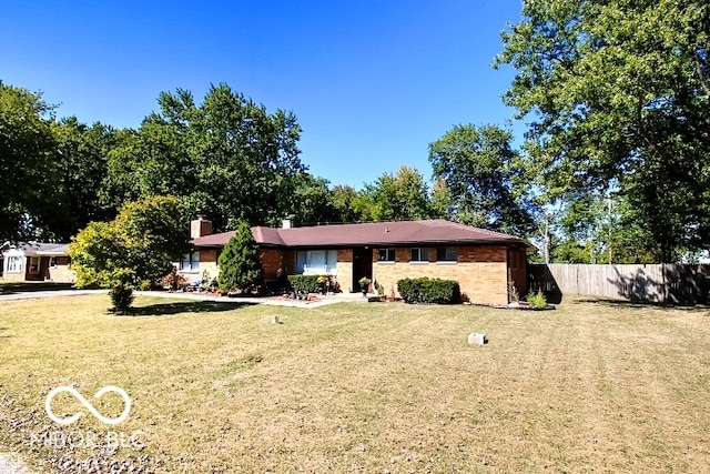 ranch-style house featuring a front lawn