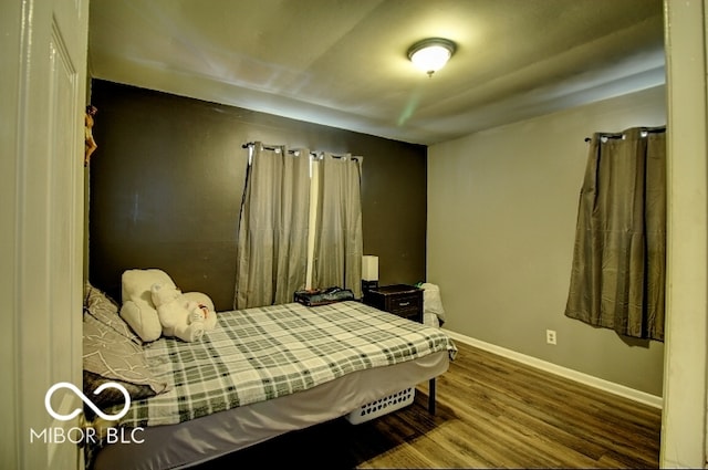 bedroom with wood-type flooring