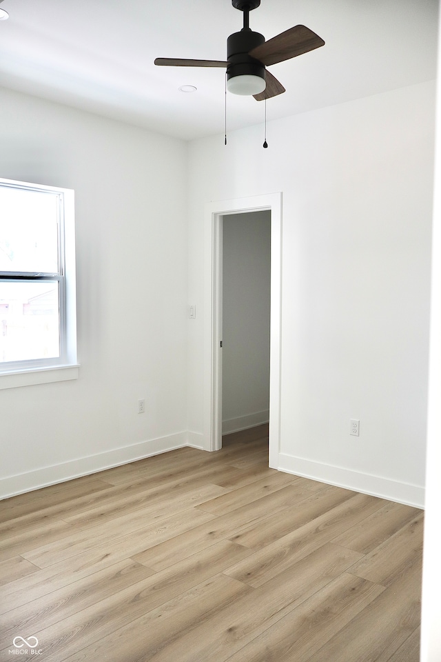 empty room featuring light hardwood / wood-style floors and ceiling fan