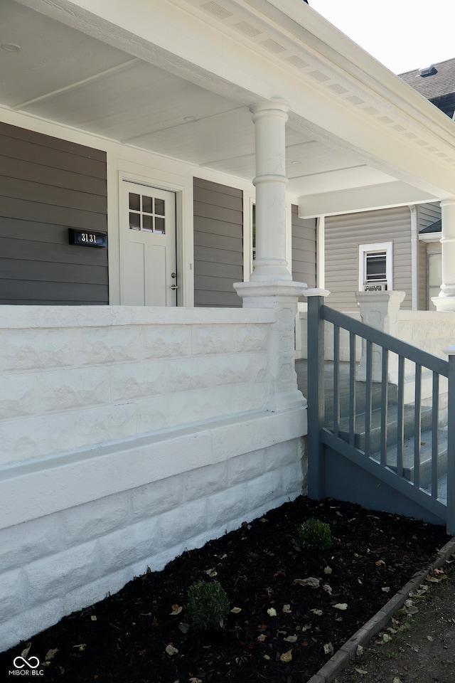 property entrance with covered porch