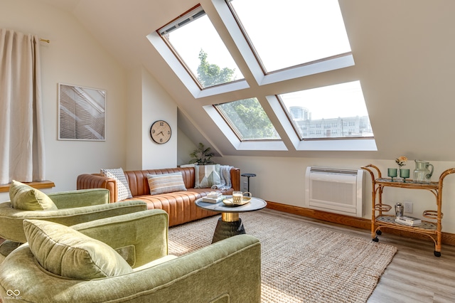 living room with wood-type flooring and vaulted ceiling with skylight