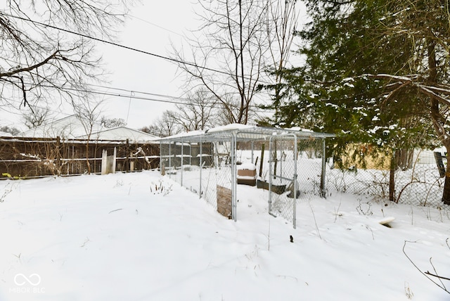 view of yard layered in snow