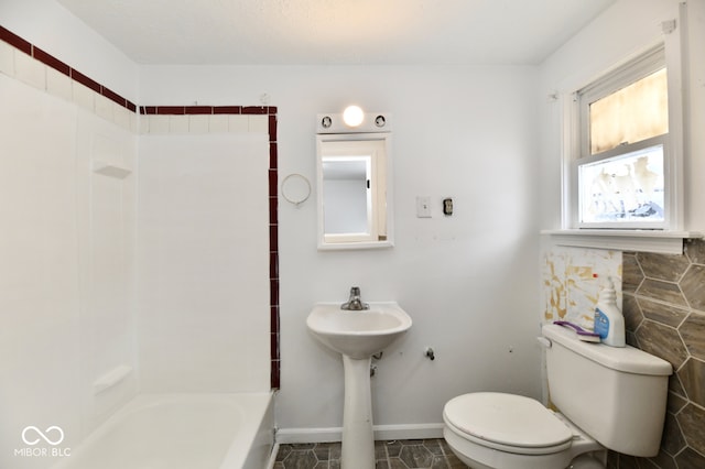 bathroom with a bath and toilet