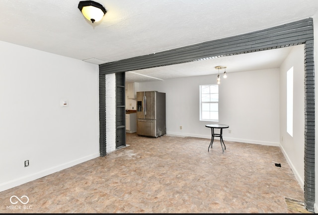 spare room featuring a textured ceiling