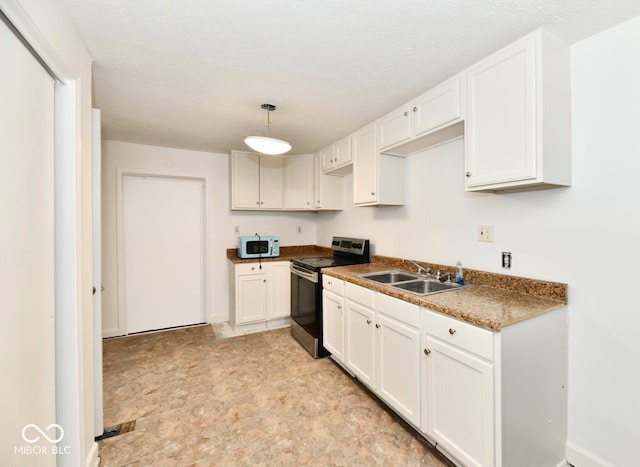 kitchen with white cabinetry, electric range, sink, and hanging light fixtures