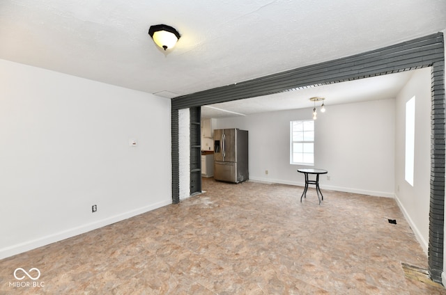 empty room featuring a textured ceiling