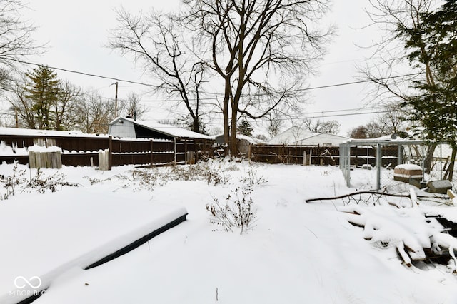 view of yard layered in snow