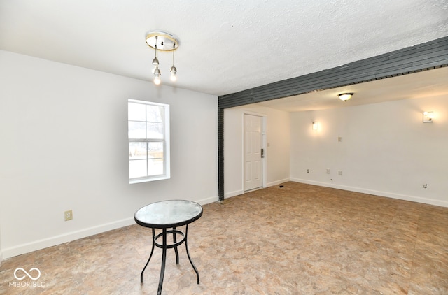 empty room featuring a textured ceiling