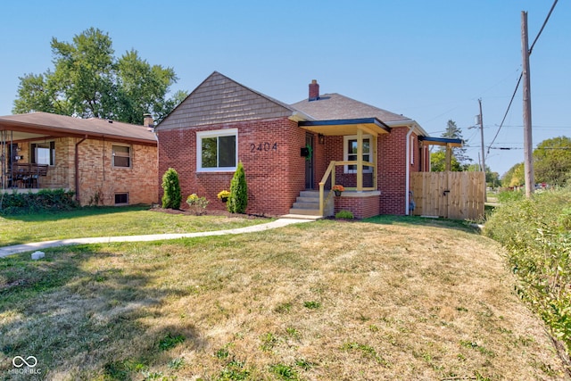 ranch-style home with a front lawn