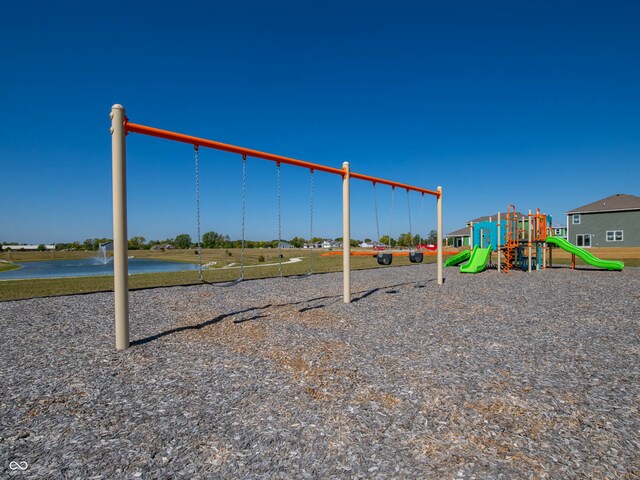 view of jungle gym featuring a water view