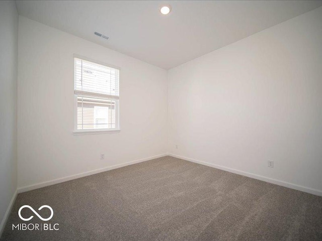 view of carpeted spare room