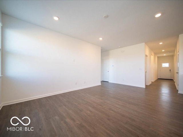 empty room featuring dark hardwood / wood-style flooring