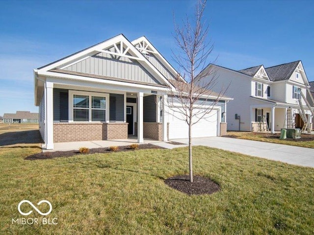 craftsman-style home with a porch, a garage, central AC unit, and a front lawn