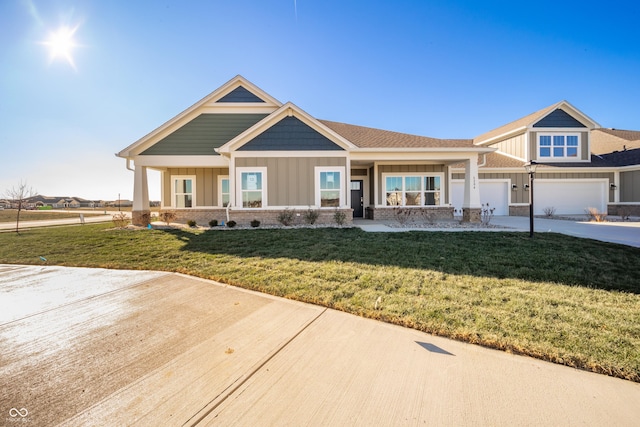 craftsman-style house with a front yard and a garage