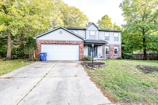 view of property with a garage and a front yard