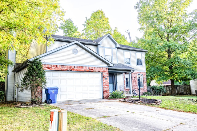 view of property with a garage and a front yard