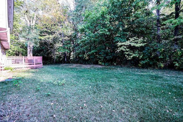 view of yard with a wooden deck