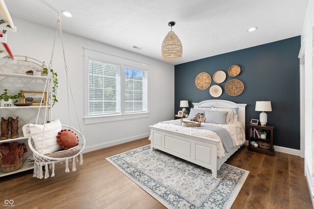 bedroom featuring dark wood-type flooring