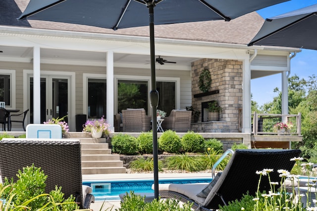 view of pool featuring ceiling fan and a patio area