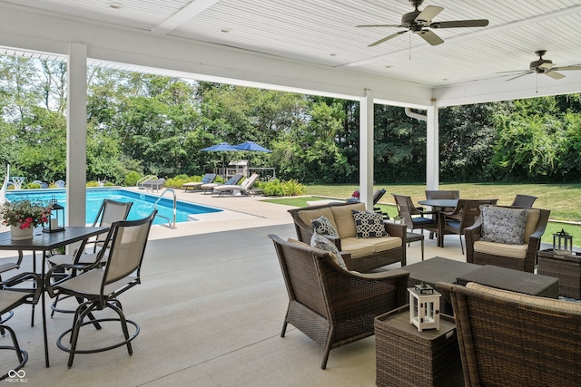 view of patio / terrace with ceiling fan and an outdoor living space