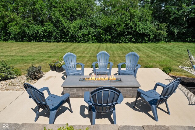 view of patio / terrace featuring an outdoor fire pit