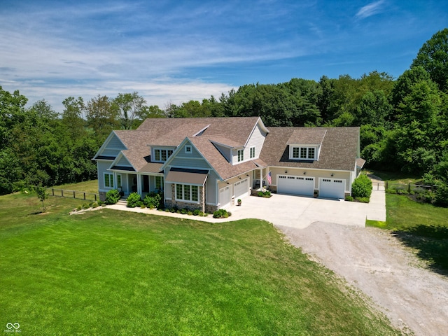 view of front facade featuring a front yard and a garage