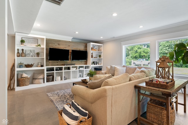 living room featuring crown molding