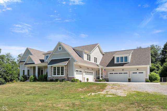 craftsman-style home featuring a front yard, a garage, and a porch