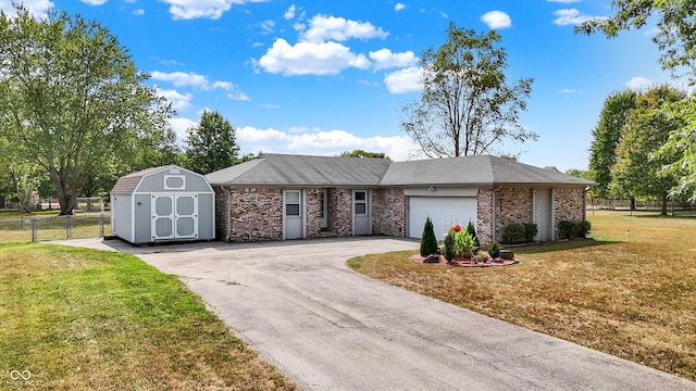 ranch-style house with a storage unit, a garage, and a front lawn