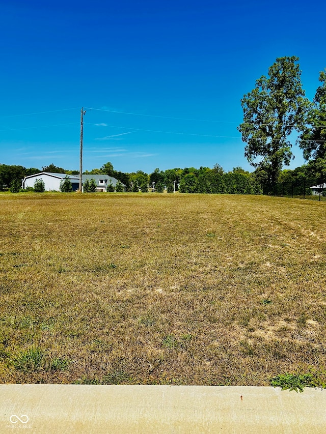 view of yard with a rural view