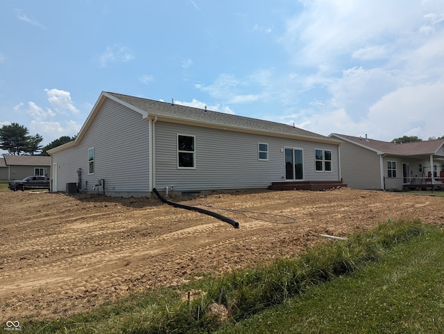 back of property featuring central air condition unit