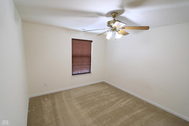 unfurnished room featuring ceiling fan and light carpet