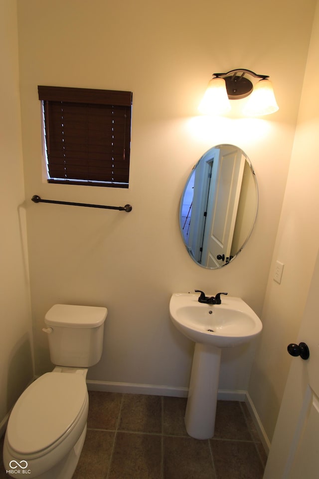 bathroom with tile patterned floors and toilet