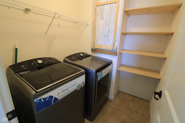 laundry area with washing machine and dryer