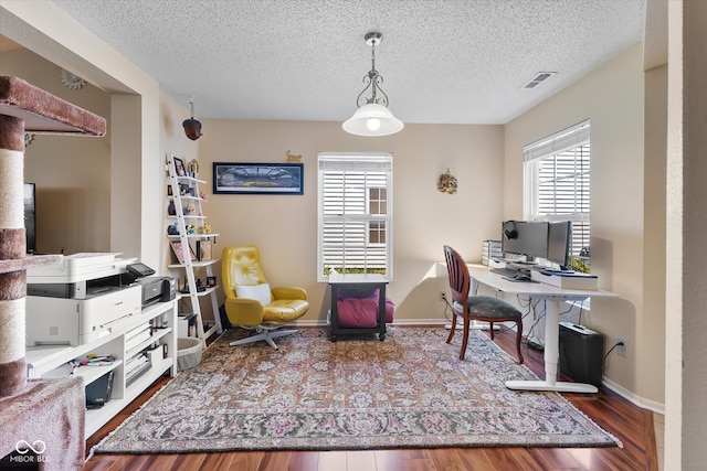 office featuring a textured ceiling and wood-type flooring