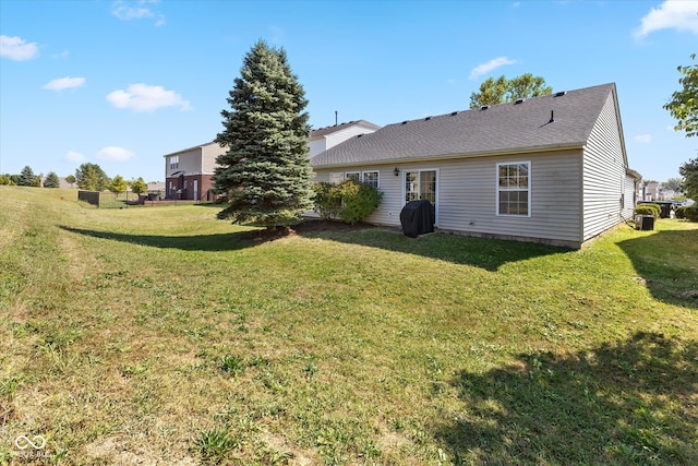 back of house with a yard