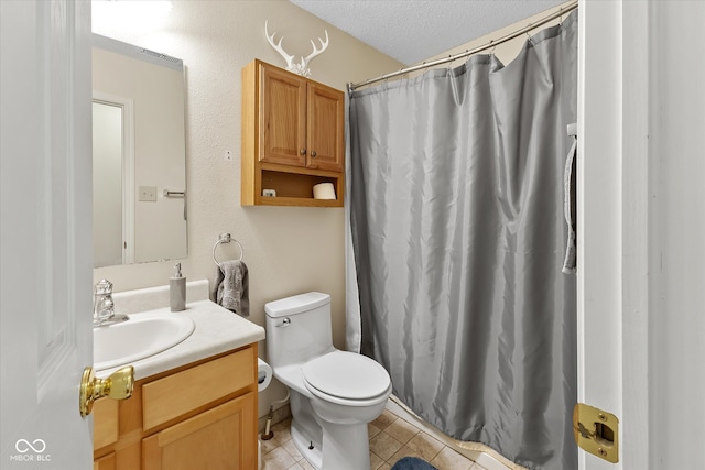 bathroom with a textured ceiling, a shower with shower curtain, tile patterned floors, vanity, and toilet