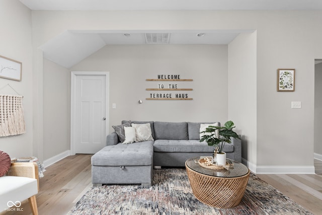 living room with light hardwood / wood-style flooring