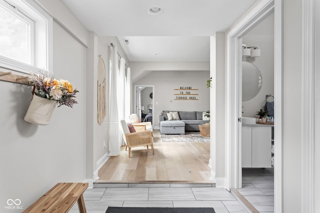 hall with light hardwood / wood-style floors