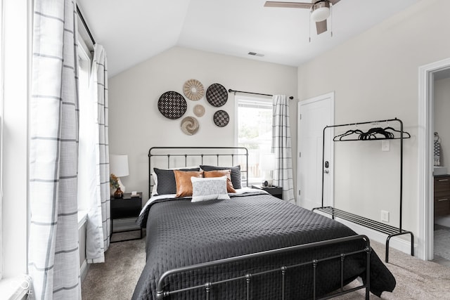 bedroom featuring carpet floors, lofted ceiling, and ceiling fan