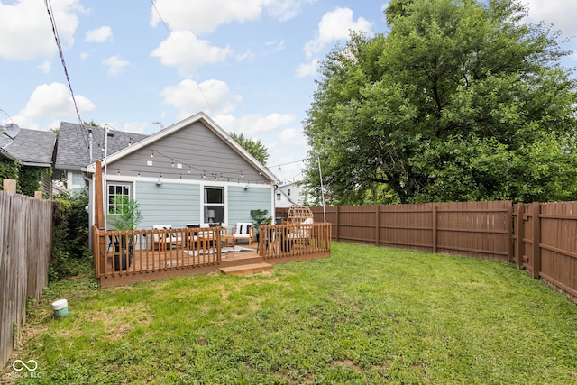 view of yard featuring a wooden deck