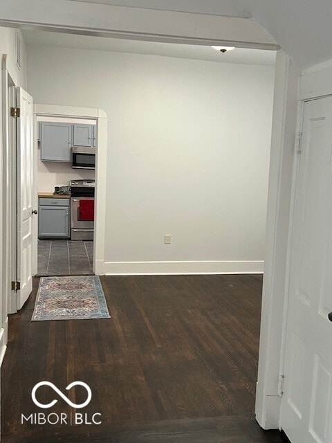 corridor featuring dark wood-type flooring