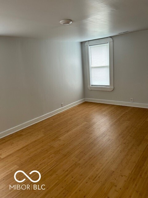 unfurnished room featuring wood-type flooring