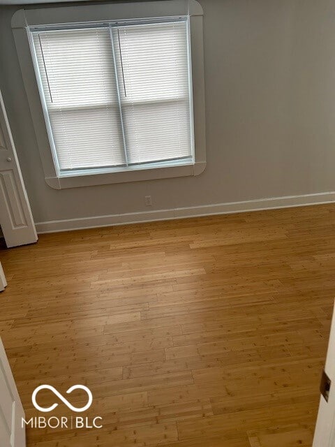 empty room with light hardwood / wood-style floors