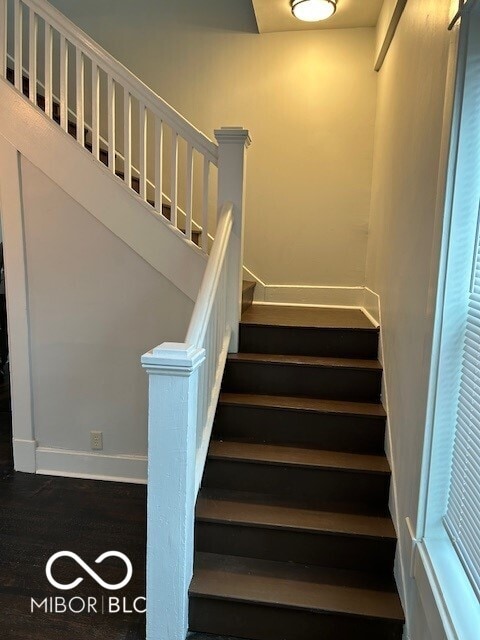 staircase featuring hardwood / wood-style flooring