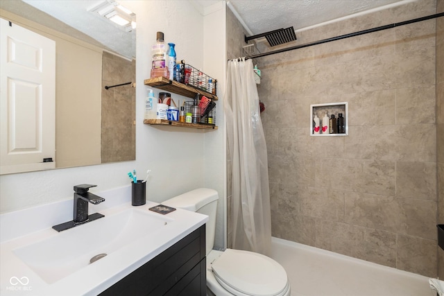 bathroom featuring a textured ceiling, walk in shower, vanity, and toilet