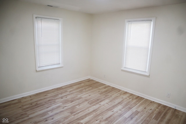 unfurnished room featuring light hardwood / wood-style flooring